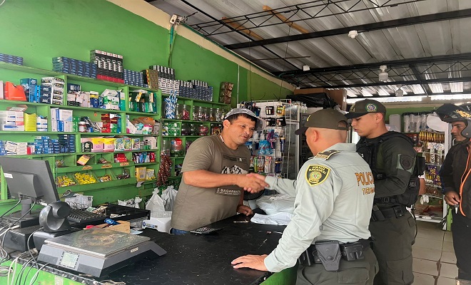 Visita al gremio de comerciantes